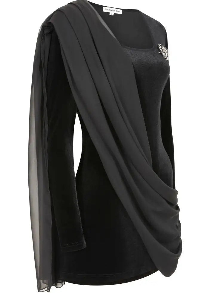 A black long-sleeve top with a draped sheer overlay and a decorative brooch on the chest, shown on a white background.